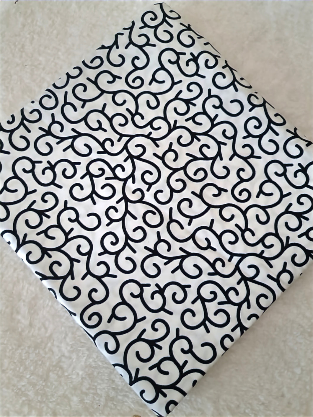 Ivory and black spiral print